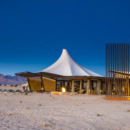 An architectural study of Dead Valley Lodge, a premier structural sanctuary positioned within the Namib-Naukluft Park; capturing the low-impact design and unyielding resilience required to coexist with the desert elements.