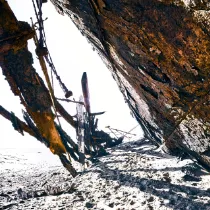 The skeletal remains of a shipwreck on the Skeleton Coast, documenting the intersection of human history and the unyielding power of the Atlantic.
