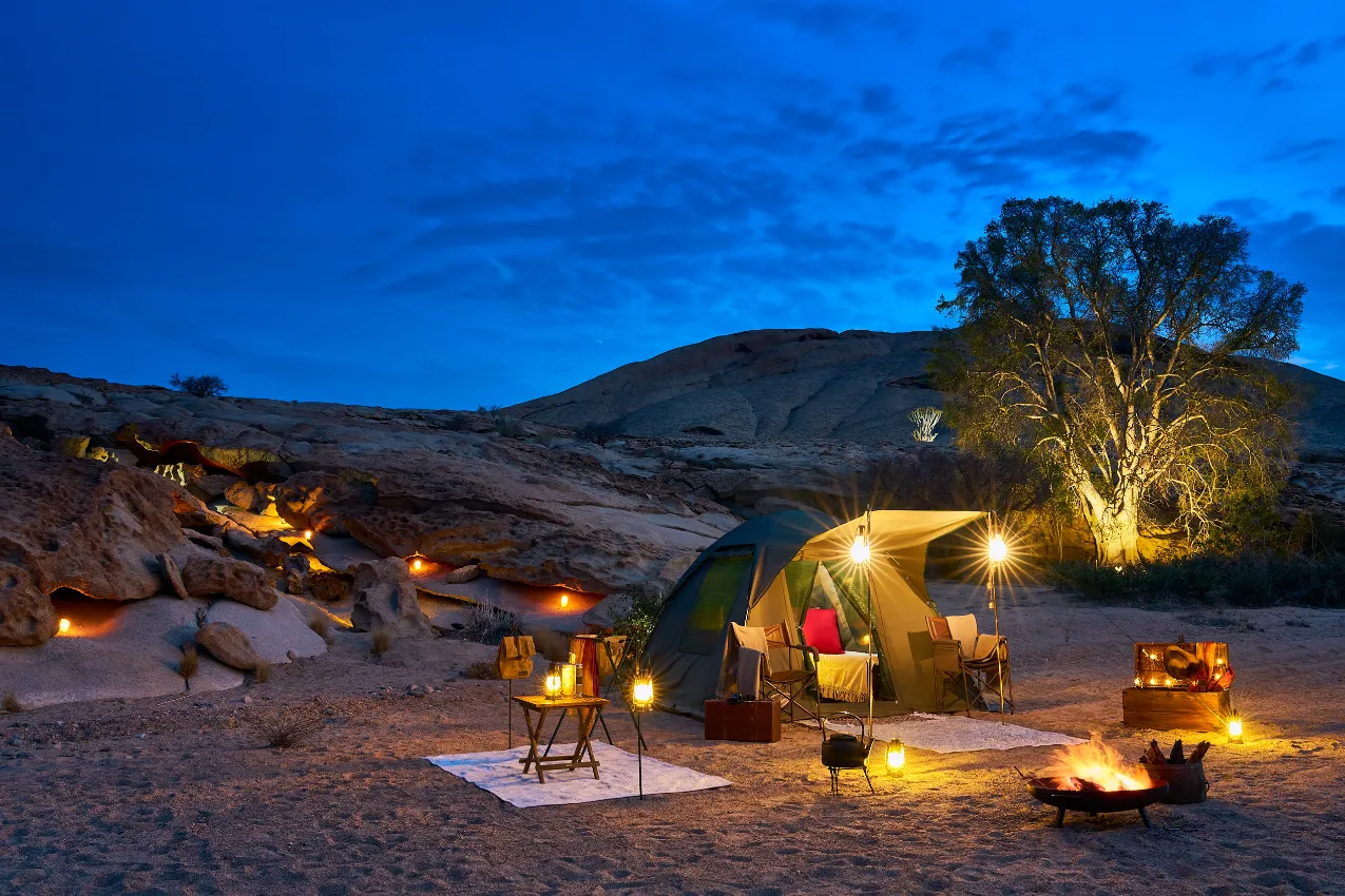 A sophisticated mobile camp set in the heart of the Namibian wild, showcasing the seamless blend of luxury and remote immersion.