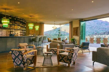 The main lobby area of Hohenstein Lodge, capturing the open-air architectural design and the transition between interior comfort and the wild.