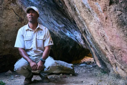 A professional guide interpreting ancient rock art, bridging the gap between modern exploration and the region's deep ancestral history.