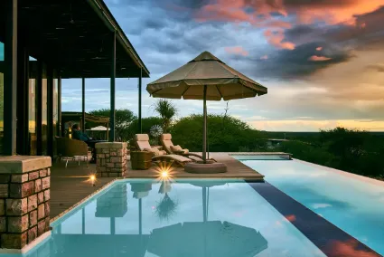 The main infinity pool at the Otjimbondona Manor House serves as a tranquil architectural centrepiece overlooking the vast plains.