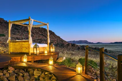 An interior perspective of the luxury suite's elevated stargazing platform, a unique structural sanctuary designed for observing the desert skies from within the unit.