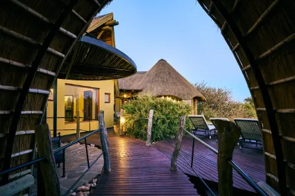 The private boardwalk entrance to a guest suite, illustrating the lodge's low-impact structural integration into the sensitive desert ecosystem.