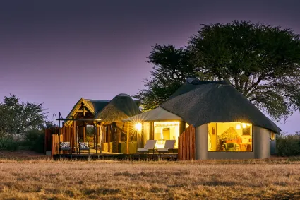 Exterior architecture of a private suite, showing the balance of stone, wood, and glass designed to honour the surrounding ancient landscape.