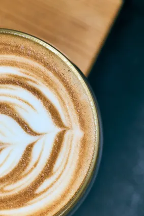 Artisanal coffee preparation at Two Beards, documenting the alchemical transition from green bean to a perfectly balanced brew.
