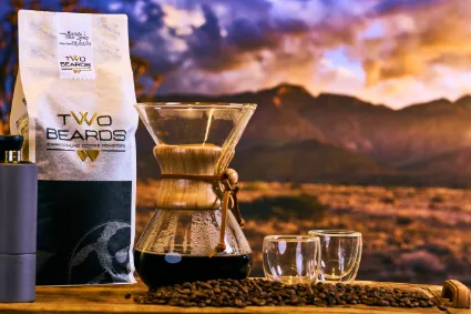 A study of freshly ground coffee, illustrating the scientific precision and consistent quality that defines the Two Beards brand narrative.