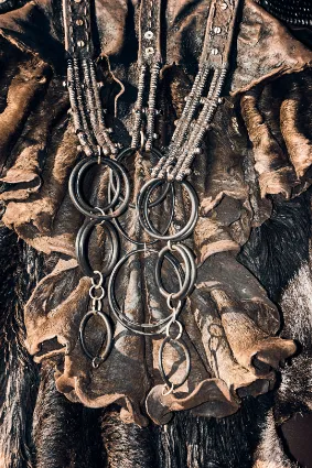 A portrait of a Himba woman adorned in traditional dress, documenting the refined aesthetic of Namibia's ancestral guardians.