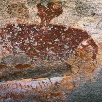 A minimalist thumbnail of the Brandberg 'Giant' rock painting, a gateway to the Dying Realms and 12,000 years of ancestral narrative.