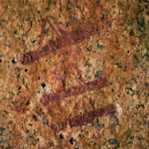 A symbolic fragment of three quivers in rock art, representing the 'Amidst the Gods' testament and the three pillars of Leopard Eye.