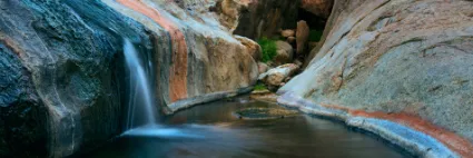 A fleeting moment of active water flow within the Sondersib Gorge, a rare and life-giving event in the arid heart of the Brandberg.