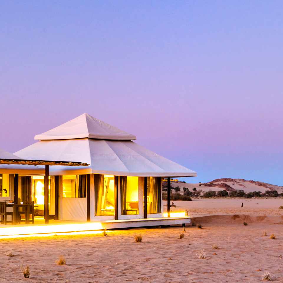 Eco-friendly luxury at Dead Valley Lodge, nestled inside Sossusvlei park, showcasing sustainable design harmonized with the Namibian desert landscape.