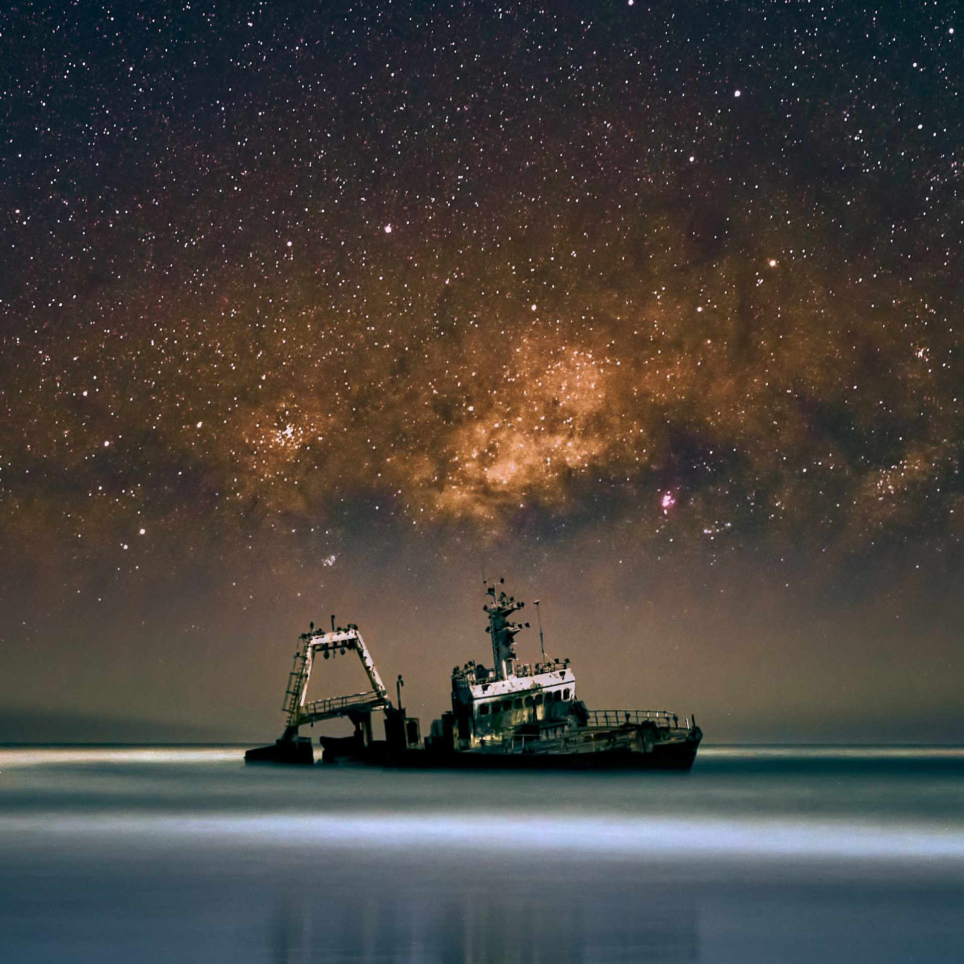 Stunning night-time capture of the Zeila shipwreck on Namibia's Skeleton Coast, with the sureal Milky Way galaxy shining brightly in the sky, clear of the usual coastal mist thanks to the gusty east wind.