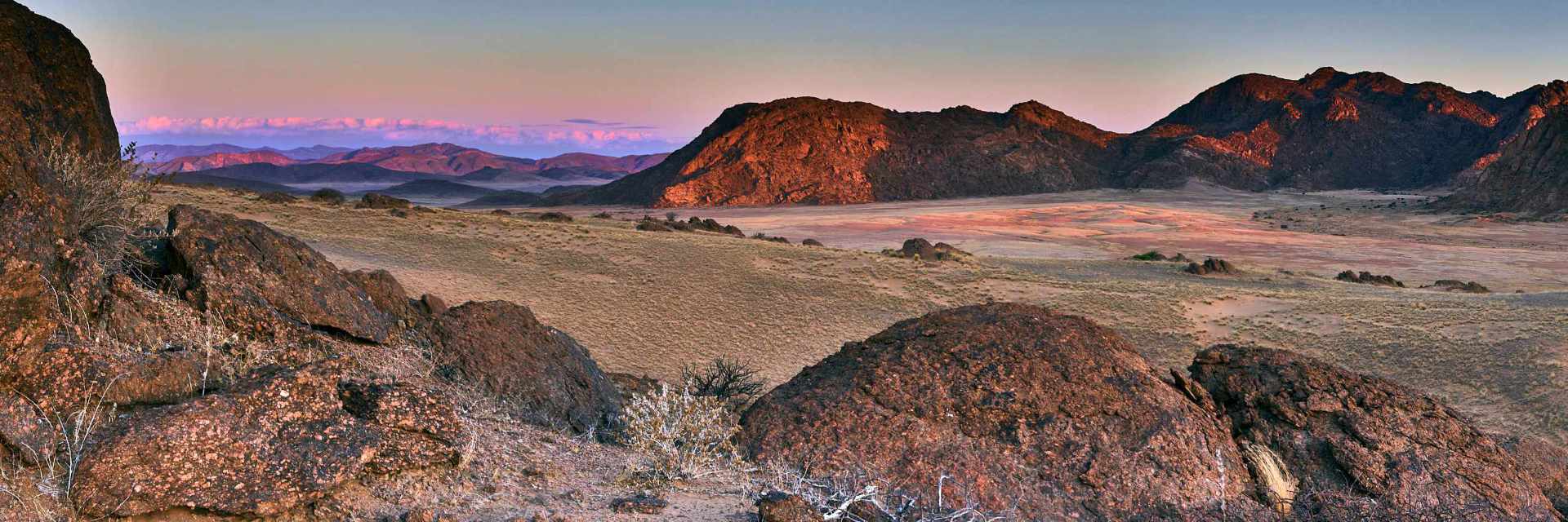 Photograph capturing the expansive vistas from Hartmann's Mountain in Northern Namibia, looking east towards the serene Hartmann's Valley.